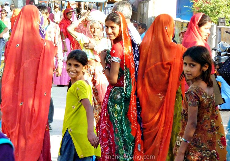 Women and girls in colourful saris on a festival day in the small town of Jojawar in Rajasthan.