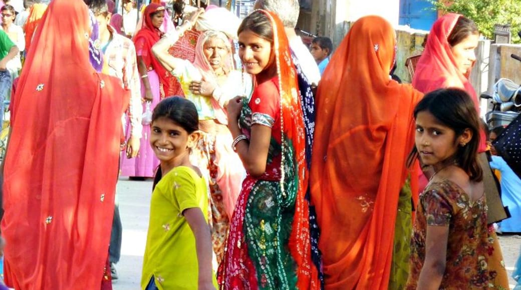 Women and girls in colourful saris on a festival day in the small town of Jojawar in Rajasthan.