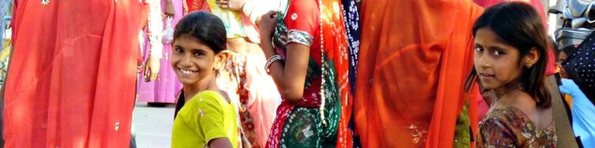 Women and girls in colourful saris on a festival day in the small town of Jojawar in Rajasthan.
