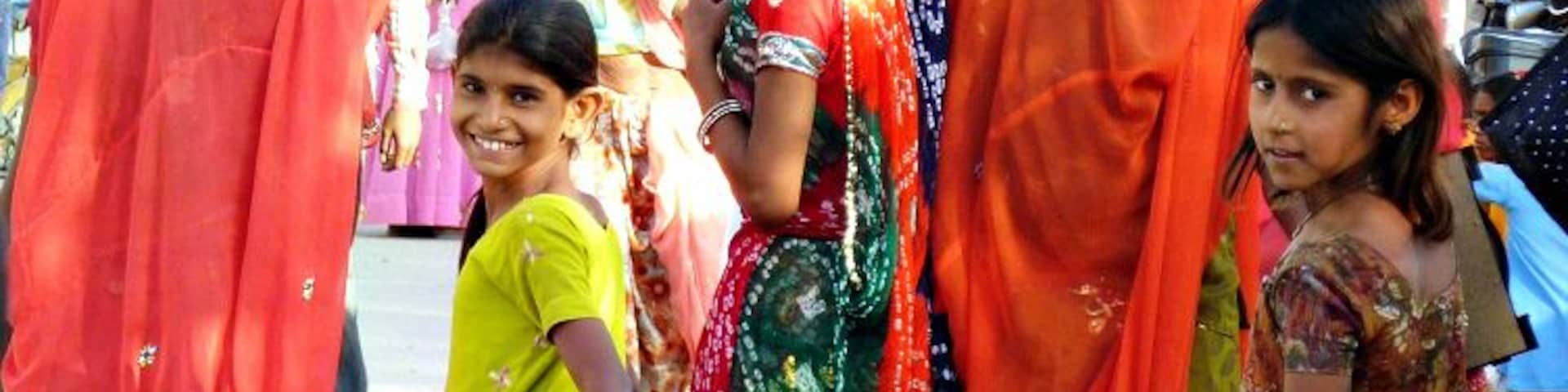 Women and girls in colourful saris on a festival day in the small town of Jojawar in Rajasthan.