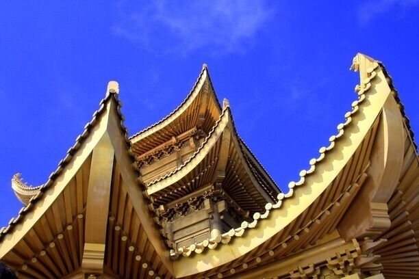 A traditional building with tiered roofs and ornate detailing.