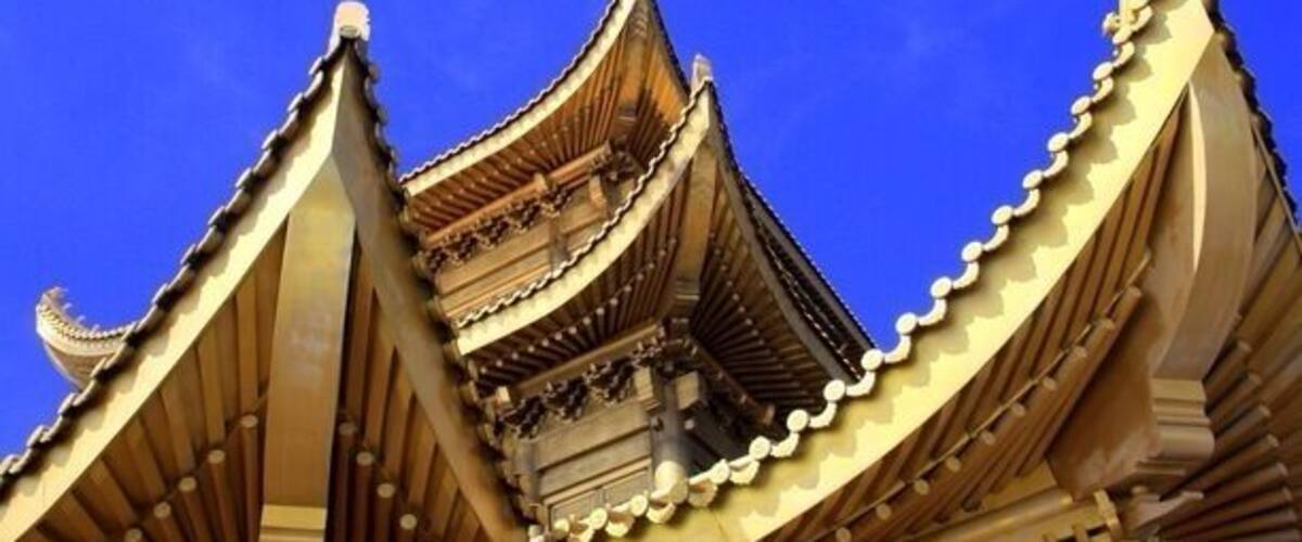 A traditional building with tiered roofs and ornate detailing.