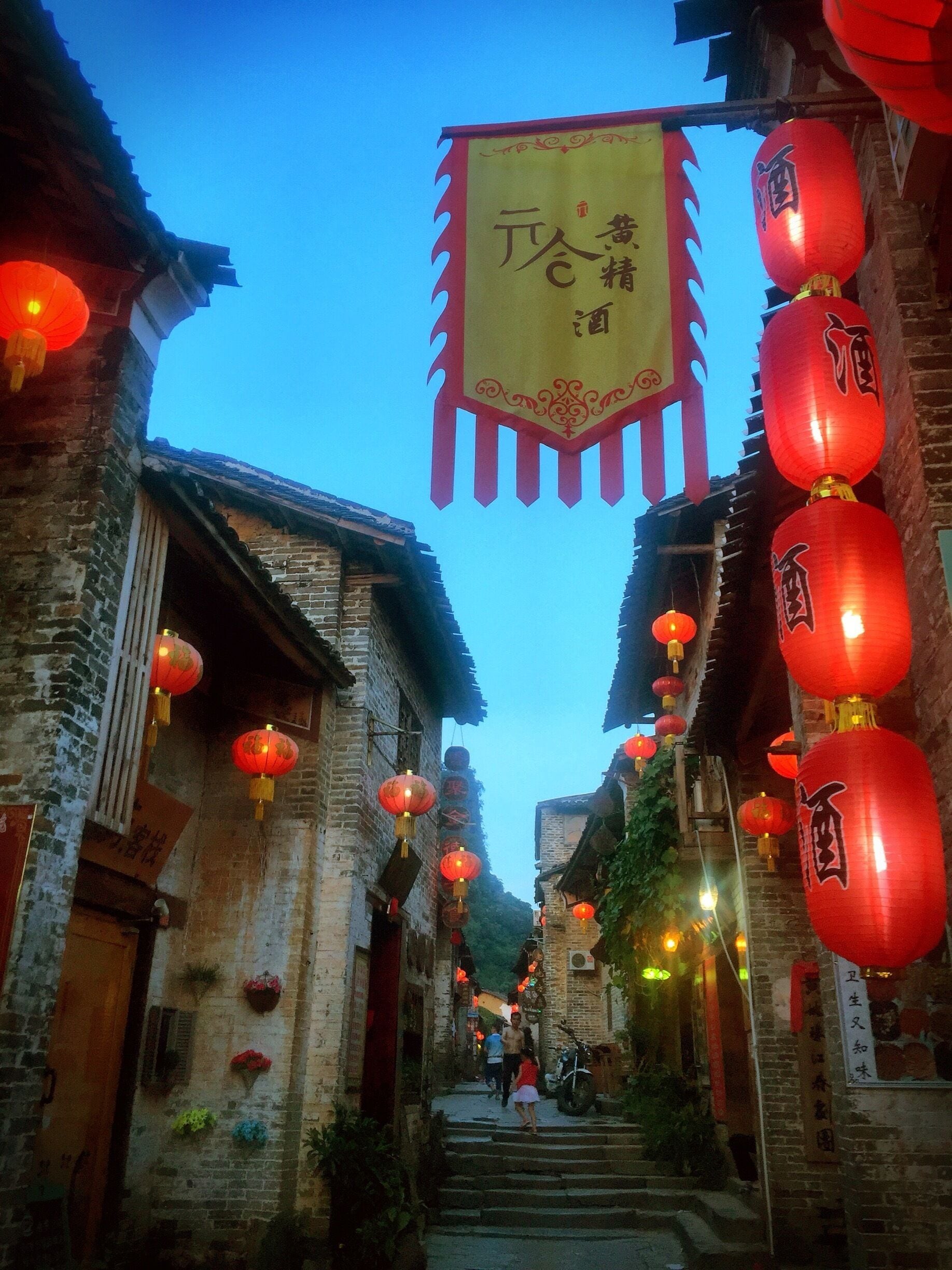 Raise the Red Lanterns. What a joy to walk along these quiet village streets lined with traditional lanterns. Huangyao 黄姚. Guangxi, China.