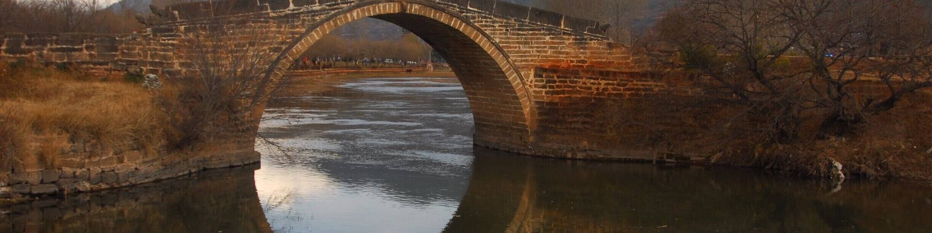 Shaxizhen - Old Bridge over the river, quiet walk and wonderful Friday cattle/animal market.