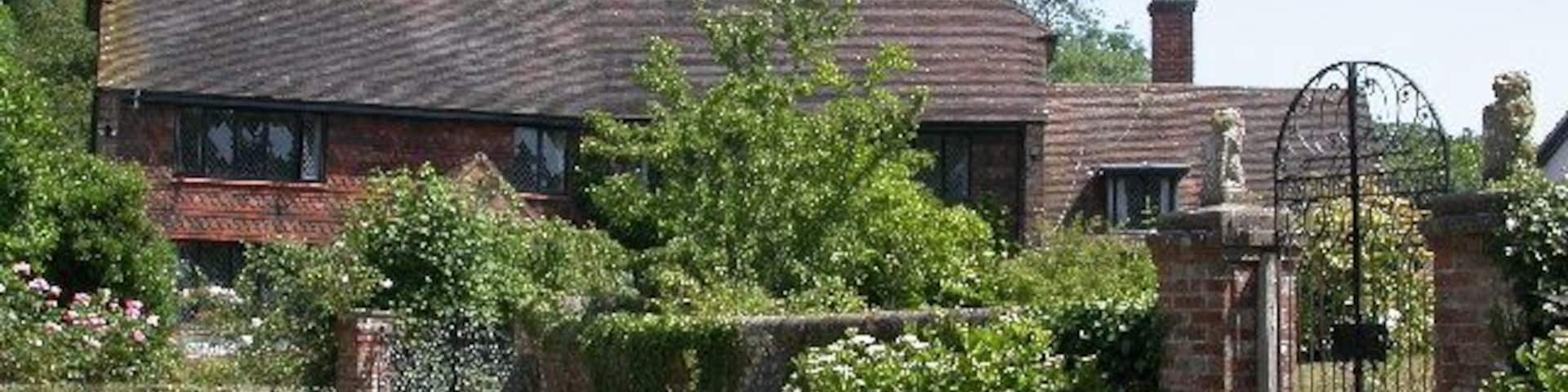 near Brewhurst Farm. Houses typical of this part of Sussex at the end of Brewhurst Lane.