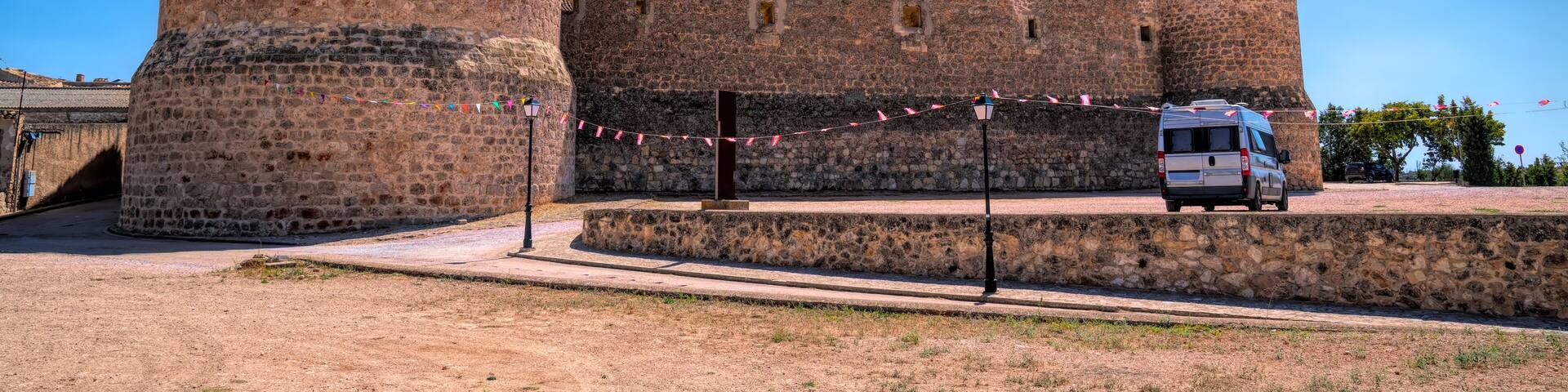 Campervan and castle Castillo de Garcimunoz Cuenca, Castile-La Mancha, Spain