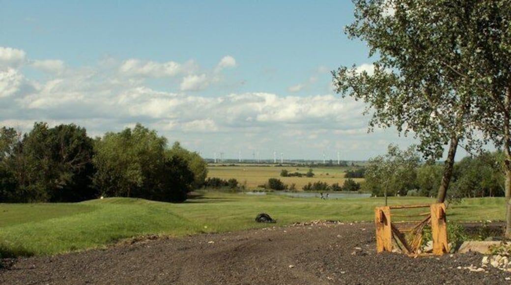 Part of the course at Lakeside Lodge Golf Centre This golf course has 8 lakes and over 15000 trees. The wind farm near Warboys can be seen in the far distance.