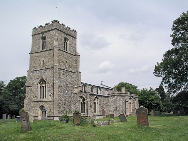 A historic stone church with a prominent tower and multiple arched windows.