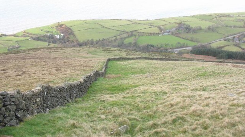 Looking downslope to the sharp bend in the boundary wall
