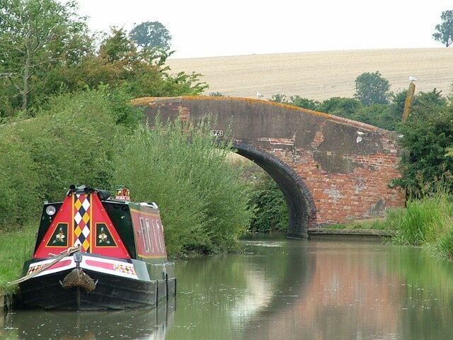 A narrowboat moored by Bridge 123 over the Oxford Canal northwest of Priors Hardwick, Warwickshire