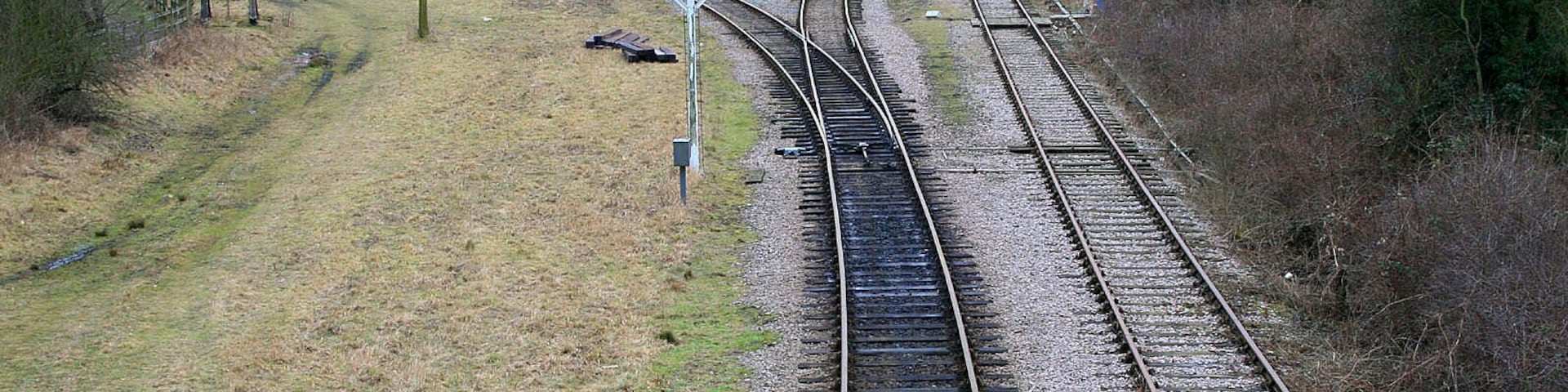 Looking south along the Great Central Railway. From a footbridge to the west of Ruddington 1723879. The branch off to the left leads to the Nottingham Transport Heritage Centre http://www.nthc.co.uk/ and was not there in the days when the railway ran from here to London Marylebone Station.