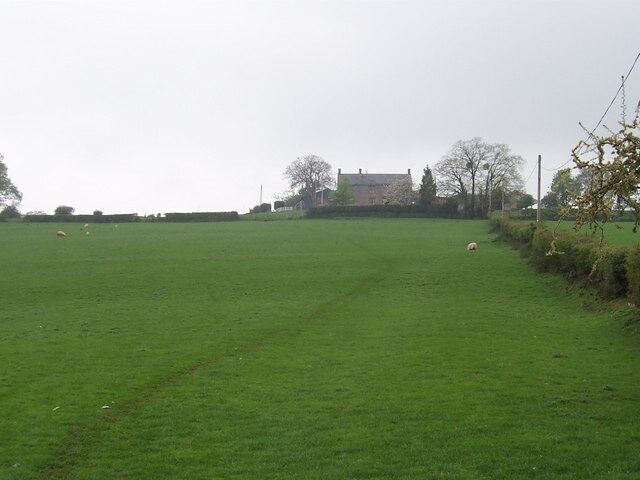 Approaching Llanerch. This shows the Offa's Dyke National Trail climbing through a field to this building ahead marked as Llanerch on the map.