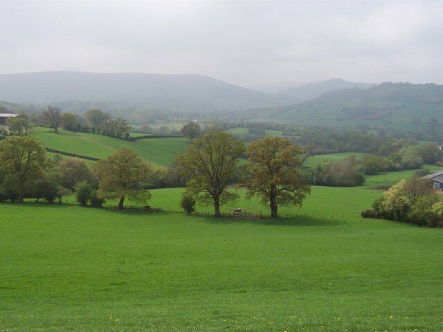 View to the Honddu Valley and the Black Mountains. This is taken from Offa's Dyke National Trail and looks south west over fields towards the Honddu Valley and beyond