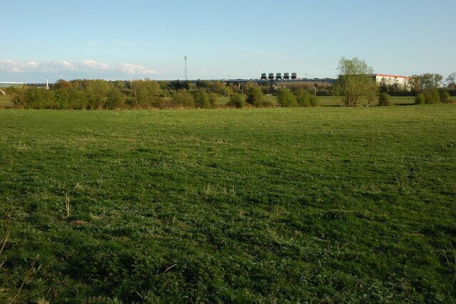 Farmland and the Llanwern Steelworks View across farmland to the Llanwern Steelworks from the churchyard of Llanwern church.