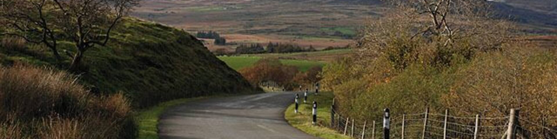 Eastern approach to Trawsfynydd Holiday Village Linking the Trawsfynydd to Abergeirw mountain road to the holiday village and the A470. In the distance lie the northern Rhinogydd, with Moel Ysgyfarnogod prominent.