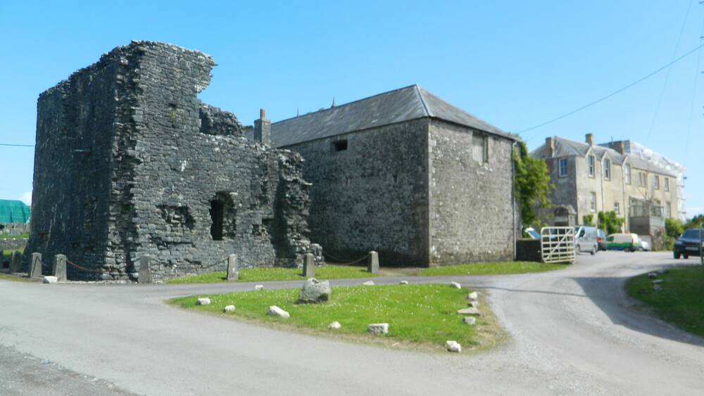 Ruins of Ewenny Priory, farm building, and mansion.
