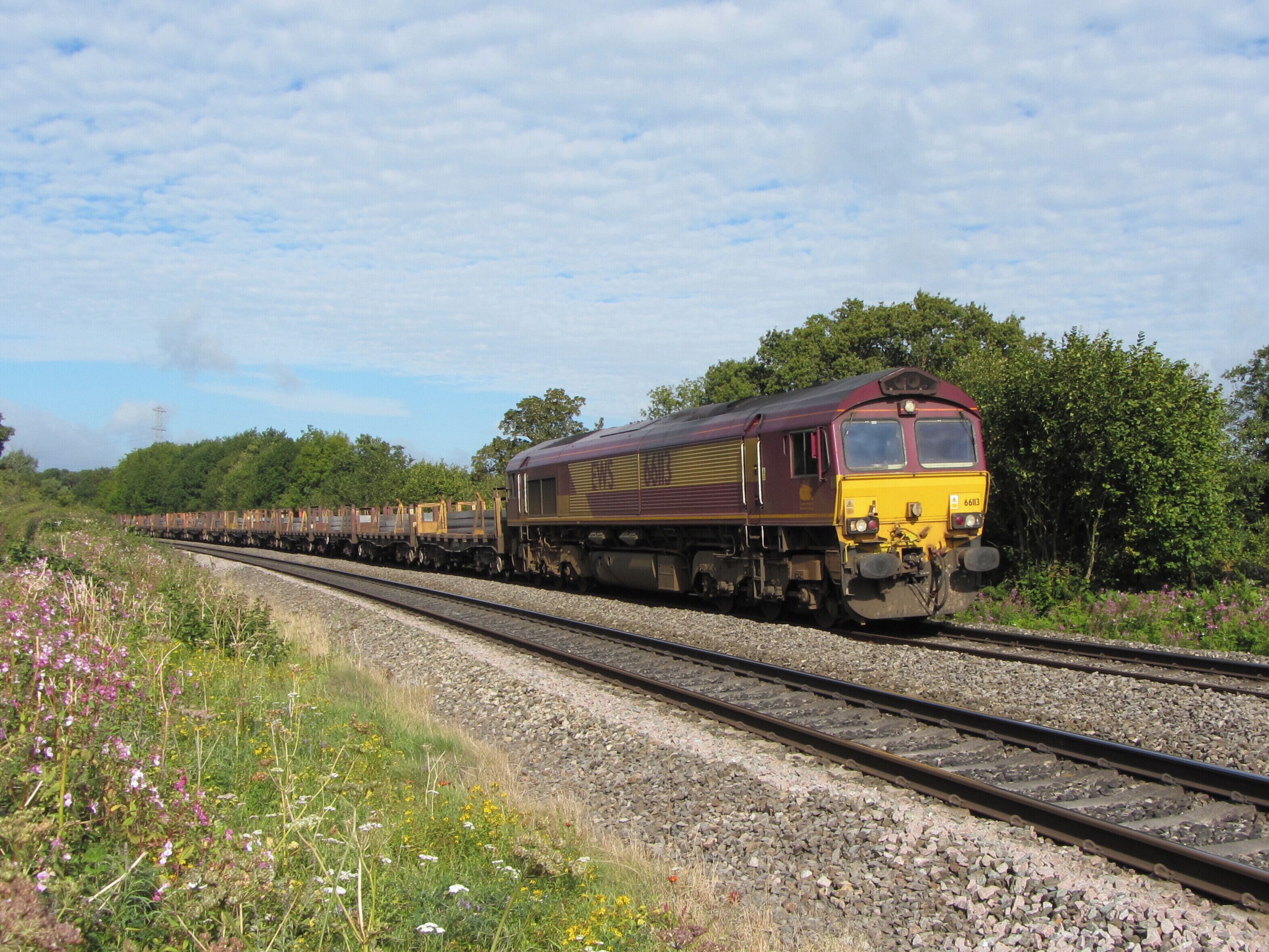 Steel train near St George's. A Margam to Llanwern steel train passes St George's, headed by locomotive No. 66113.