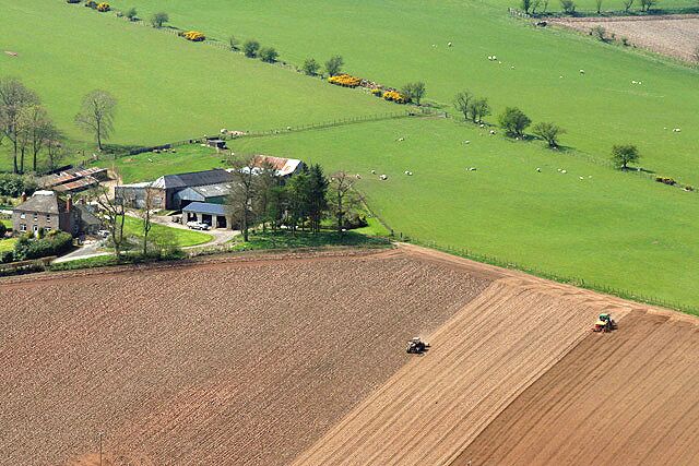 Preparing a field at Langraw Farm Viewed from Bonchester Hill in the adjoining square.