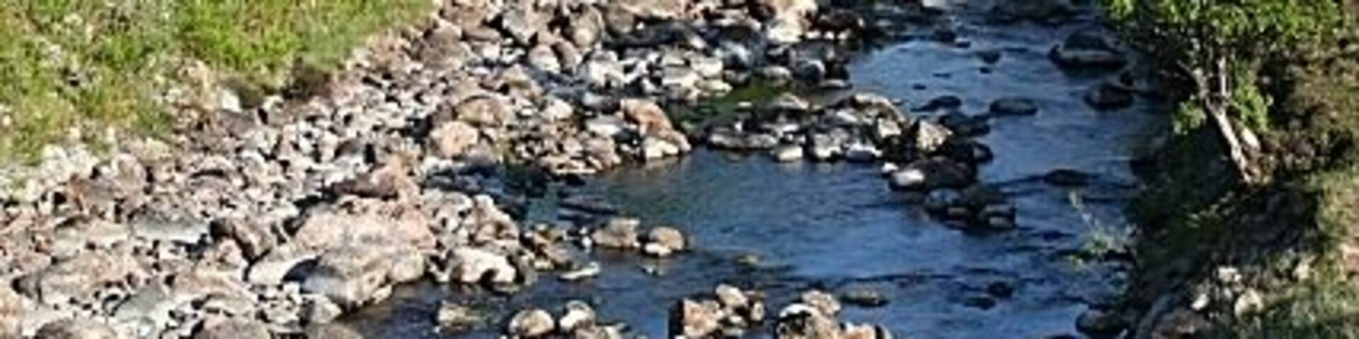 The Old Bridge from the New Bridge The more elevated viewpoint on the new bridge provides a much more satisfying view than was previously possible. The mountain in the distance is Arcuil (Arkle).
