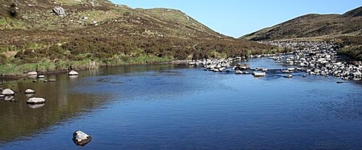 Rhiconich River This pool is created by a barrier of boulders, so that there are pools for salmon to lie and anglers to catch them, in spite of the low water level.