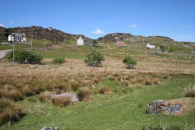 Achlyness Typical croft houses line the roadside, with the croft land below.