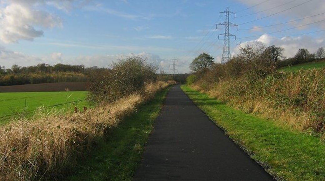 Dunfermline-Alloa railway. Now a cyclepath. Entering the square beneath Carneil Hill. Looking west.
