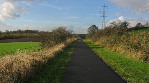 Dunfermline-Alloa railway. Now a cyclepath. Entering the square beneath Carneil Hill. Looking west.