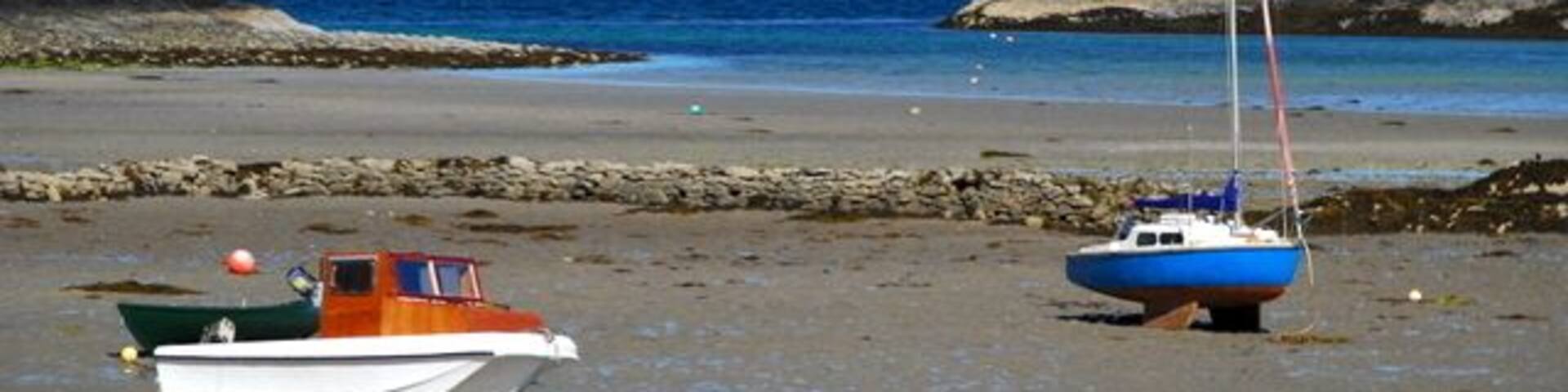 Eigg & Rum from Glenuig Only oystercatchers for company here. Rum towers above the Sgurr of Eigg.