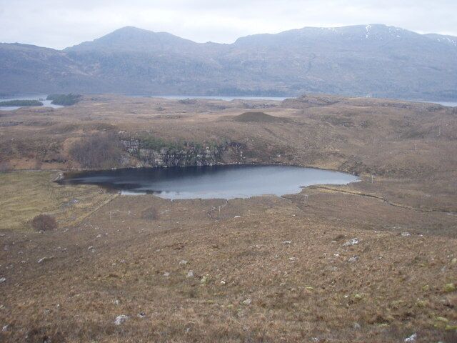 Loch na Fideil Loch Maree in the background. Loch na Fideil drains into Loch Maree.
