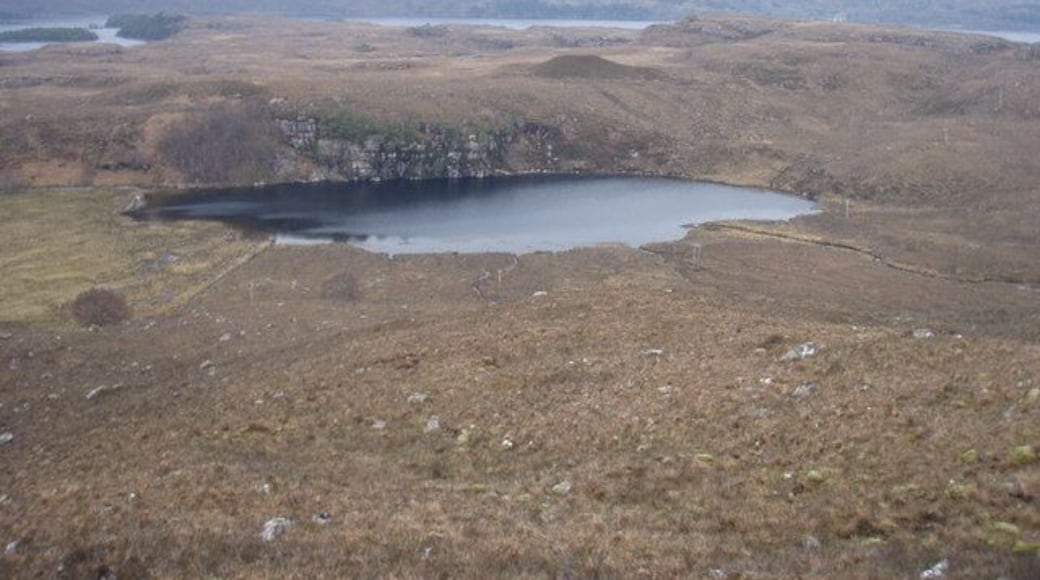 Loch na Fideil Loch Maree in the background. Loch na Fideil drains into Loch Maree.