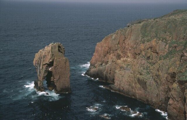 Sea Stack "Da Kist" The coastline within this square contains a number of cliffs and sea stacks. Most are somewhat loose and unsuitable for climbing, but the stack in this photo now has a route on the landward side facing away from this shot.
