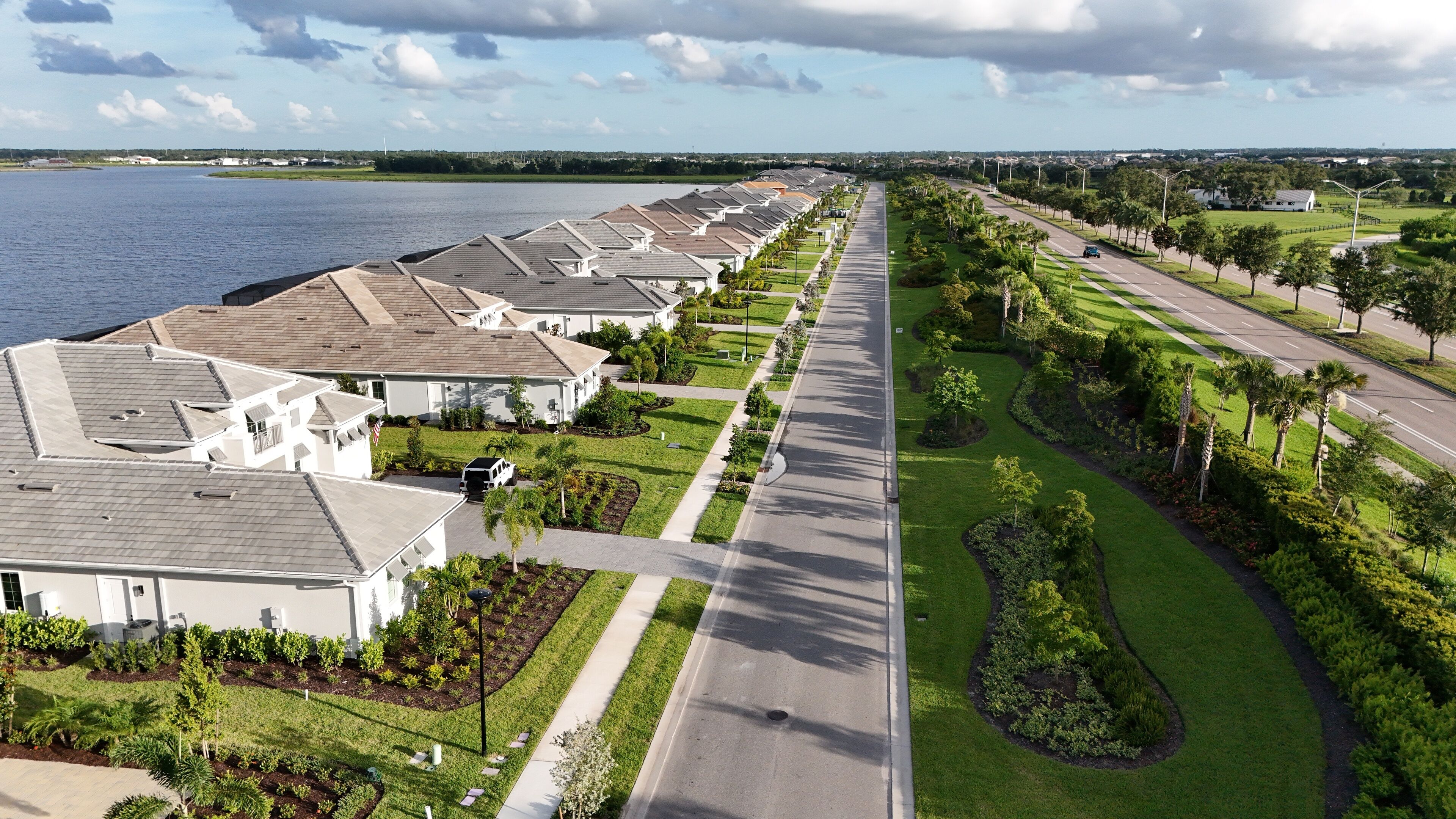 busy roads are separated by strong lines of landscaping foliage in Lakewood Ranch, Florida