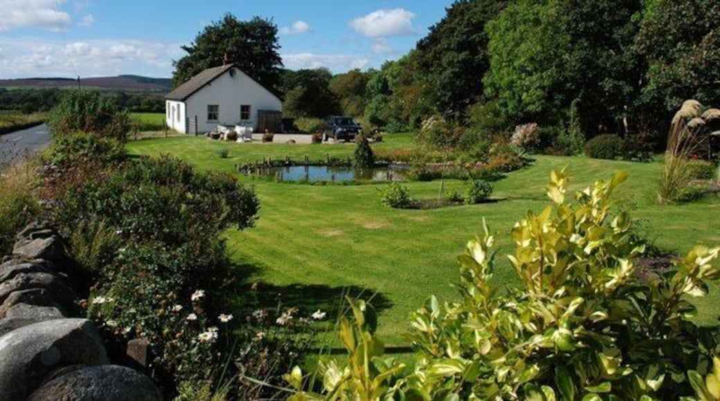 "Sealladhan Dheas" cottage, Bridgend This attractive cottage and garden lie alongside Clauchan Water. The stone wall to the left of the picture is part of the bridge over the burn and the road is the B880, leading into Shiskine.