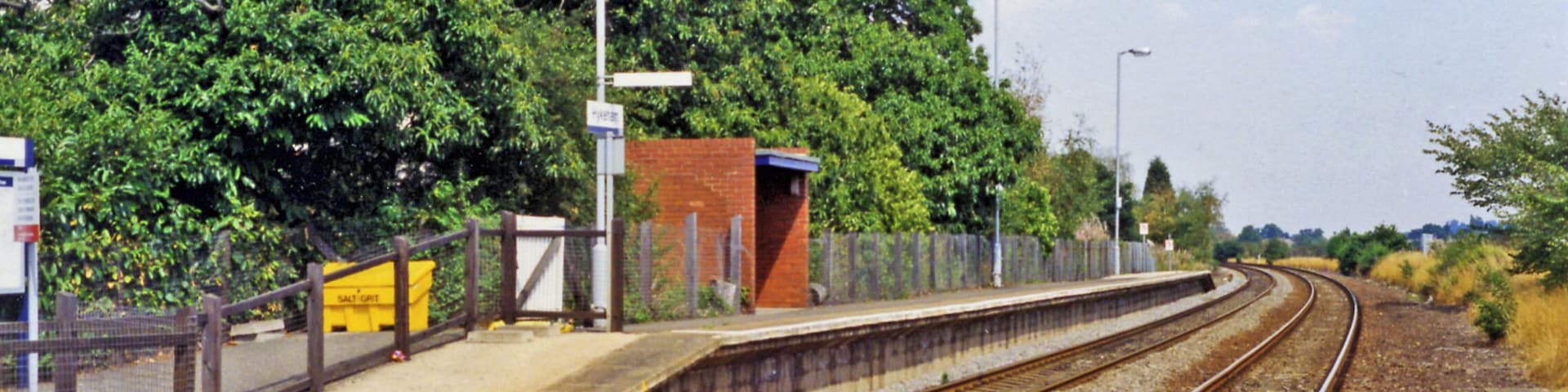 Hykeham station, Lincoln platform 1995. View eastwards, towards Lincoln: ex-Midland Nottingham - Newark Lincoln line. The westbound platform is behind, on the other side of the level-crossing
