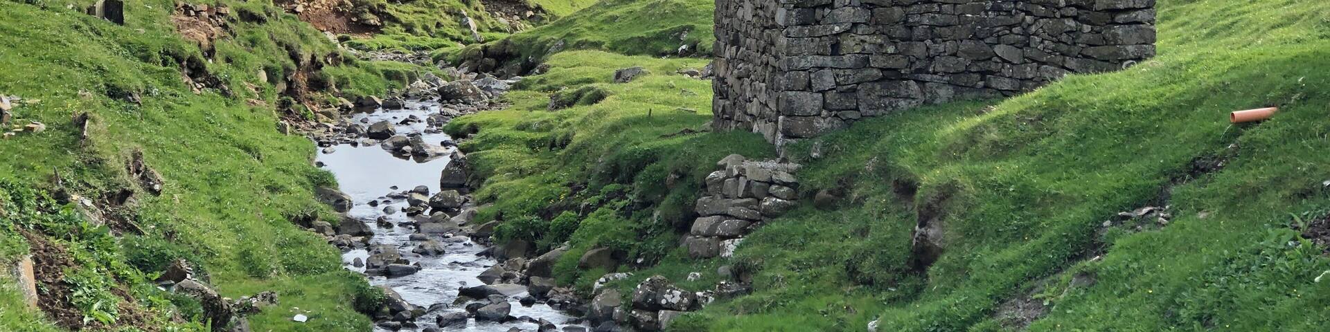 The small village on Mykines only has about a dozen year long residents. The helicopter supplies them twice a week and takes them to one of the other islands if they have the need. During the summer many visitors come to see the birds that nest on the island or one of the islets close by. There are also summer residents many who have family history on the island. This old stone building houses supplies and equipment.