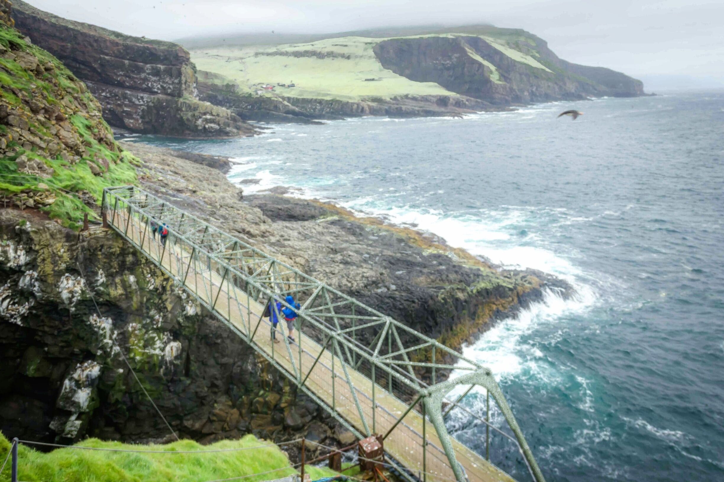 This small footbridge over the North Atlantic Ocean in Mykines speaks so much about the resilience of Faroese people. 
Built over a 35 metre deep gorge, it has been swept off two times in the past due to ferocious winds and high crashing waves. 
And yes, we did cross this bridge to reach #Mykinesholmur. Lot more about this hike on the blog - #linkinbio 😍