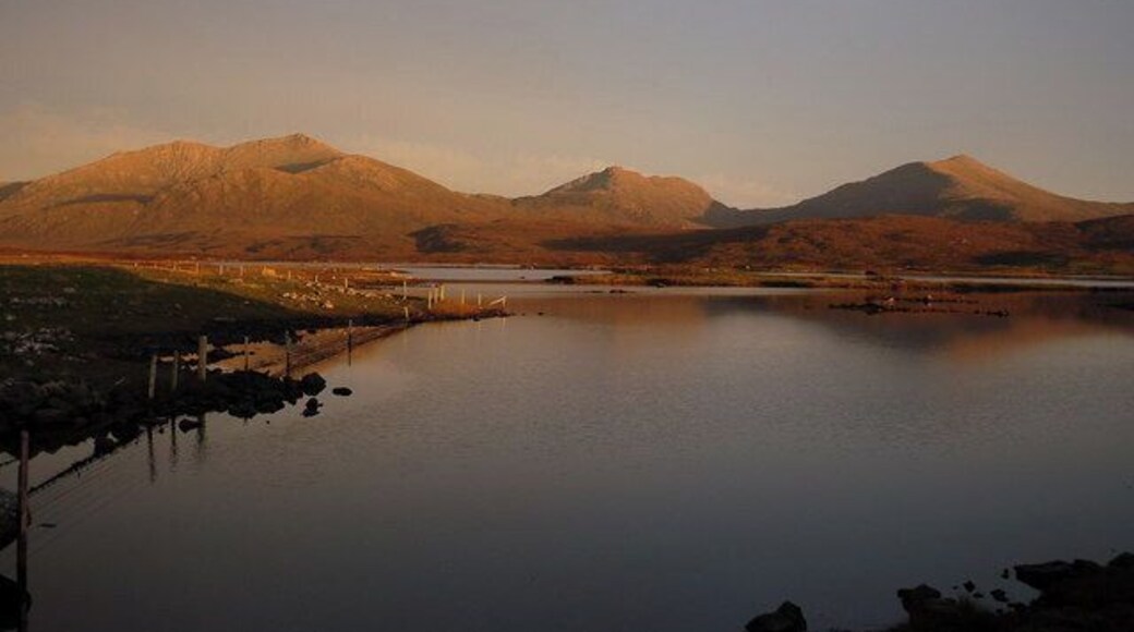 Loch Druidibeg. Low evening sunset across Loch Druidibeg illuminating (left to right)Hecla, Ben Corodale and Beinn Mhor.