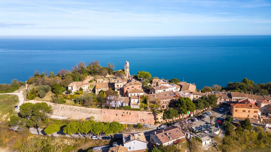 Italy, November 19, 2023 - aerial view of the small medieval village of Fiorenzuola di Focara immersed in the San Bartolo park in the province of Pesaro and Urbino in the Marche region
