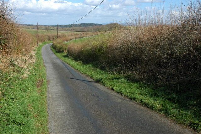 Country road near Hope Mansell Road Ruardean to Ross-on-Wye. The Malvern Hills can be seen on the horizon.