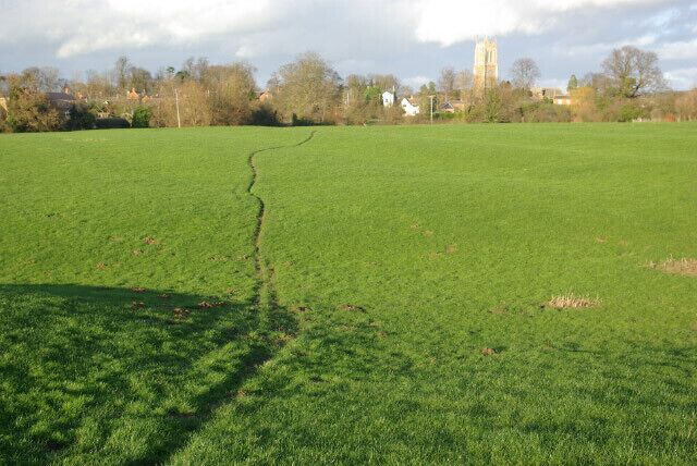 Farmland south of Lower Brailes This field is crossed by two footpaths leading to Lower Brailes village. The tower of Lower Brailes church can be seen beyond the field.