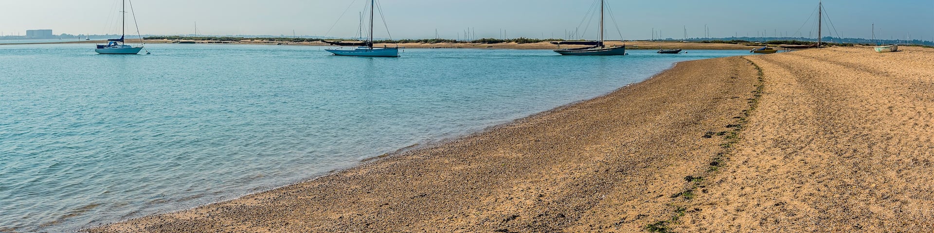 A panorama view of Blackwater estuary from the shore at West Mersea, UK in the summertime