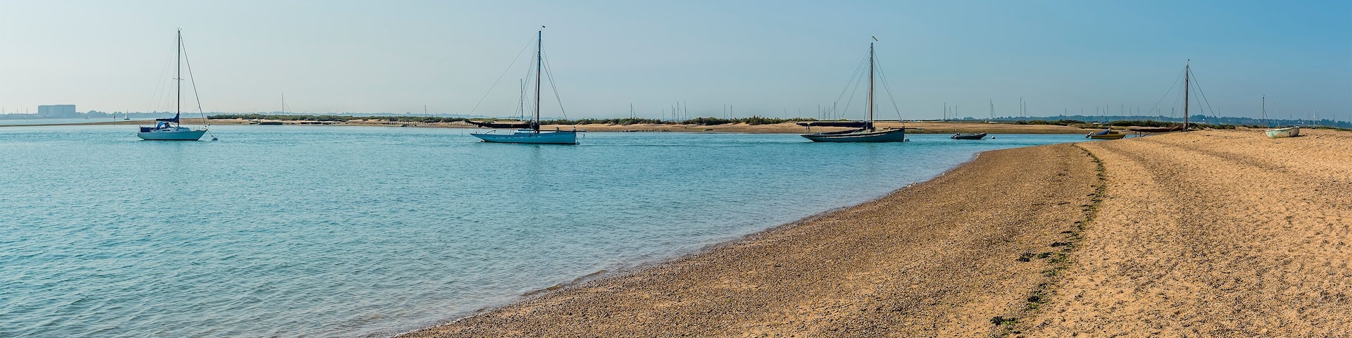 A panorama view of Blackwater estuary from the shore at West Mersea, UK in the summertime