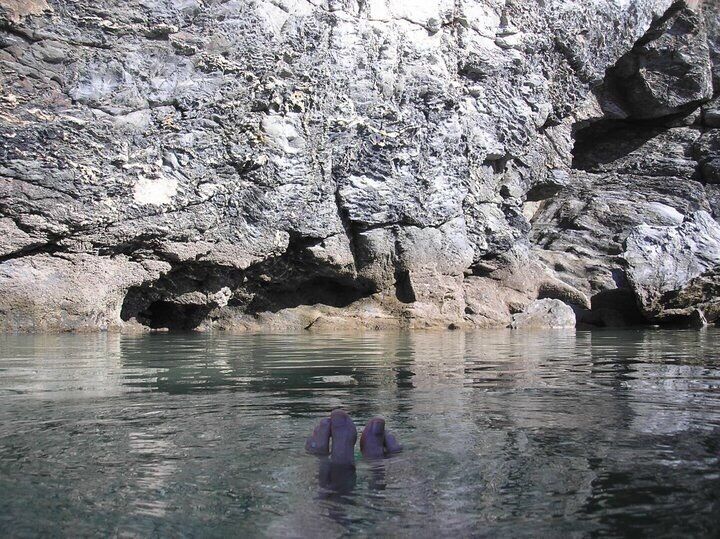 In the next village to where I live (which is a seaside village with a popular surfing beach) there is a pool carved out next to 100 foot cliffs.  At high tide the waves break over the end wall and refresh the water.  It's pretty well hidden, so if you don't know it's there you might miss it.  And yes, those are my toes.