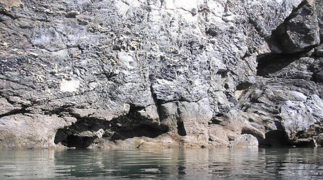 In the next village to where I live (which is a seaside village with a popular surfing beach) there is a pool carved out next to 100 foot cliffs. At high tide the waves break over the end wall and refresh the water. It's pretty well hidden, so if you don't know it's there you might miss it. And yes, those are my toes.