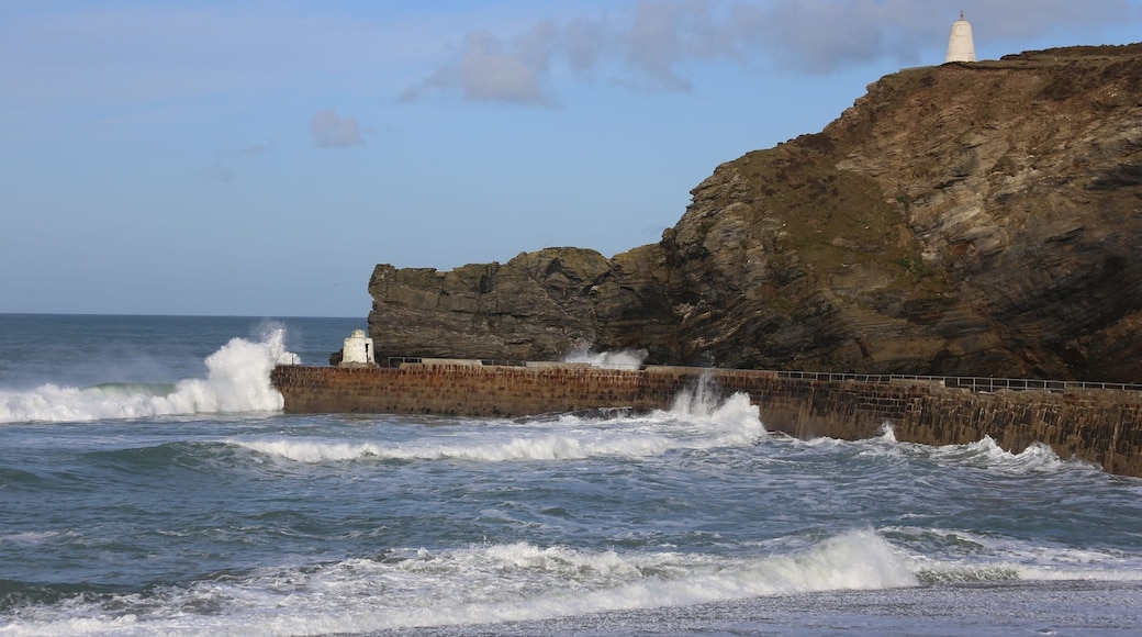 This shot was taken from the beach on glorious winter morning showing the entrance to the harbour with the lighthouse on the cliff. Porthtowen can be very dramatic in the winter and surfing is popular.