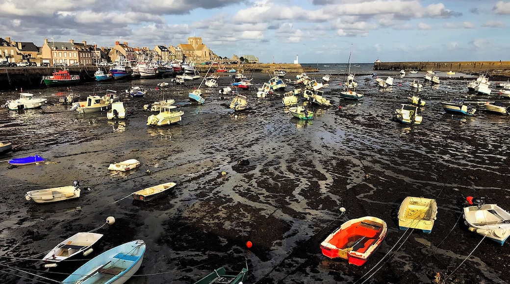 In Normandy, on the English Channel, Barfleur is a gentle sea town with dramatic tides.
1066: A large medallion fixed to a rock in the harbour marks the Normans' departure from Barfleur before the battle of Hastings