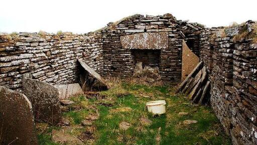 Derelict crofthouse The stark reality of bygone rural life in Orkney is all too evident here. No romantic, rose-tinted rural idyll. The most basic accommodation, peat fire, tiny windows down one side and a low roof. That's some lintel over the fireplace though.