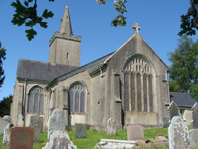A historic church with a tall tower and arched windows.
