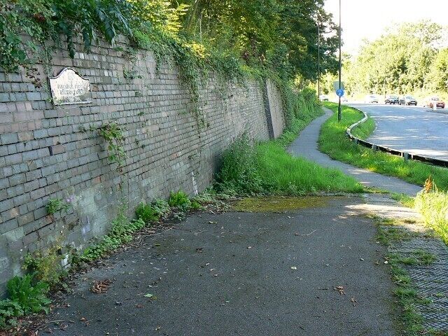 The site of Dudbridge Station, Stroud. There was a railway station on the Midland railway from 1867 until 1969. The platform can still be seen. There is also a plaque commemorating the life of the station visible on the left and seen close up in this image 932036