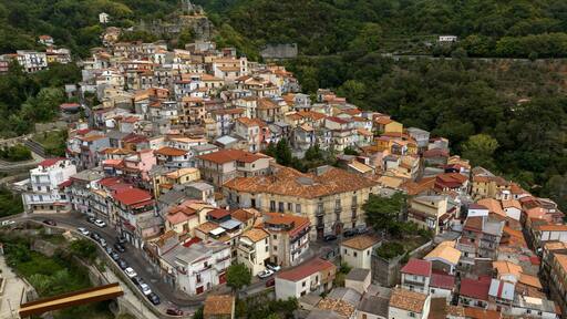 Aerial panoramic view of the historic center of the town of Lamezia Terme, in the province of Catanzaro, Calabria, Italy. These are the old houses of the Nicastro district, perched on the hill.